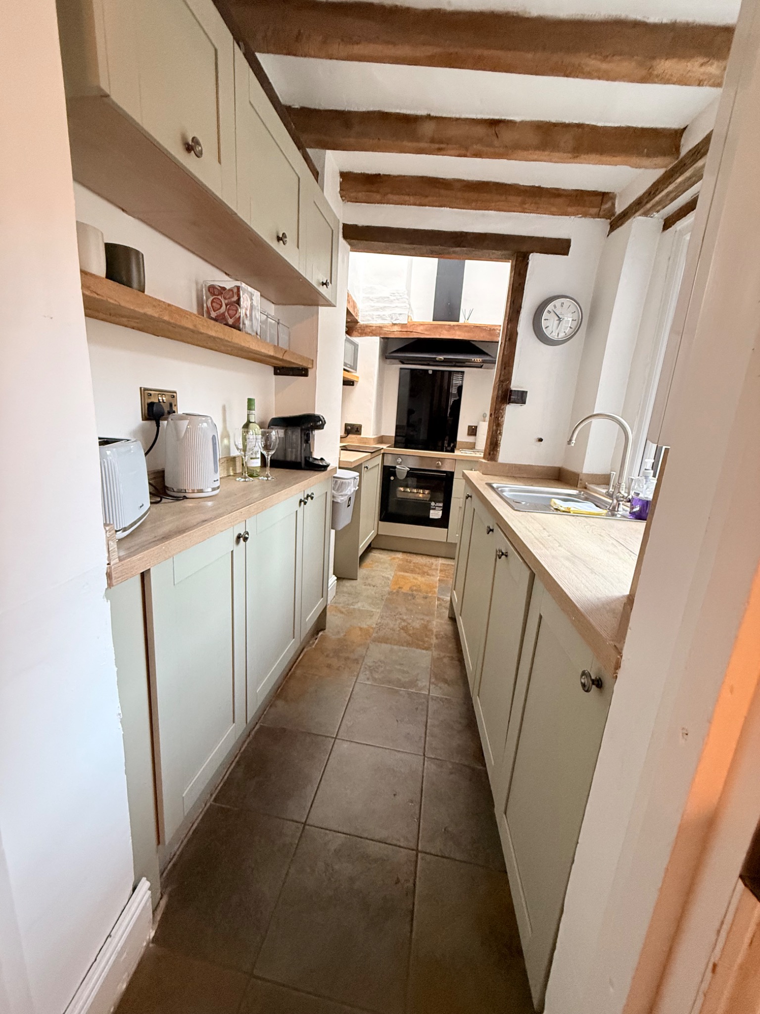 The Nook kitchen with timber beams and fitted cabinets